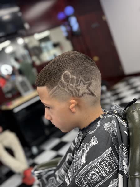 Kids fade with a star hair design at Salt City Barber Shop in Liverpool, NY
