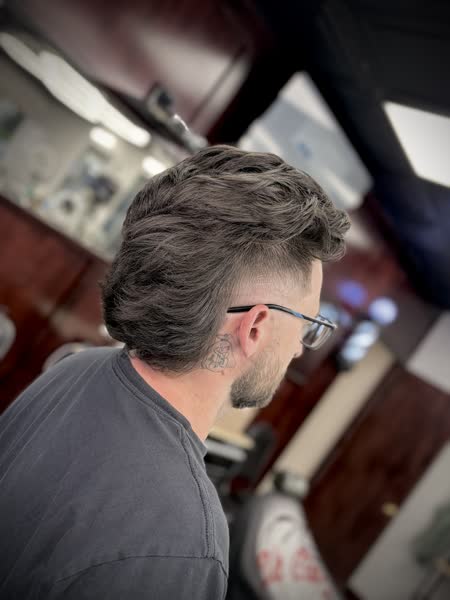 Medium-length flow with a taper fade at Salt City Barber Shop in Liverpool, NY